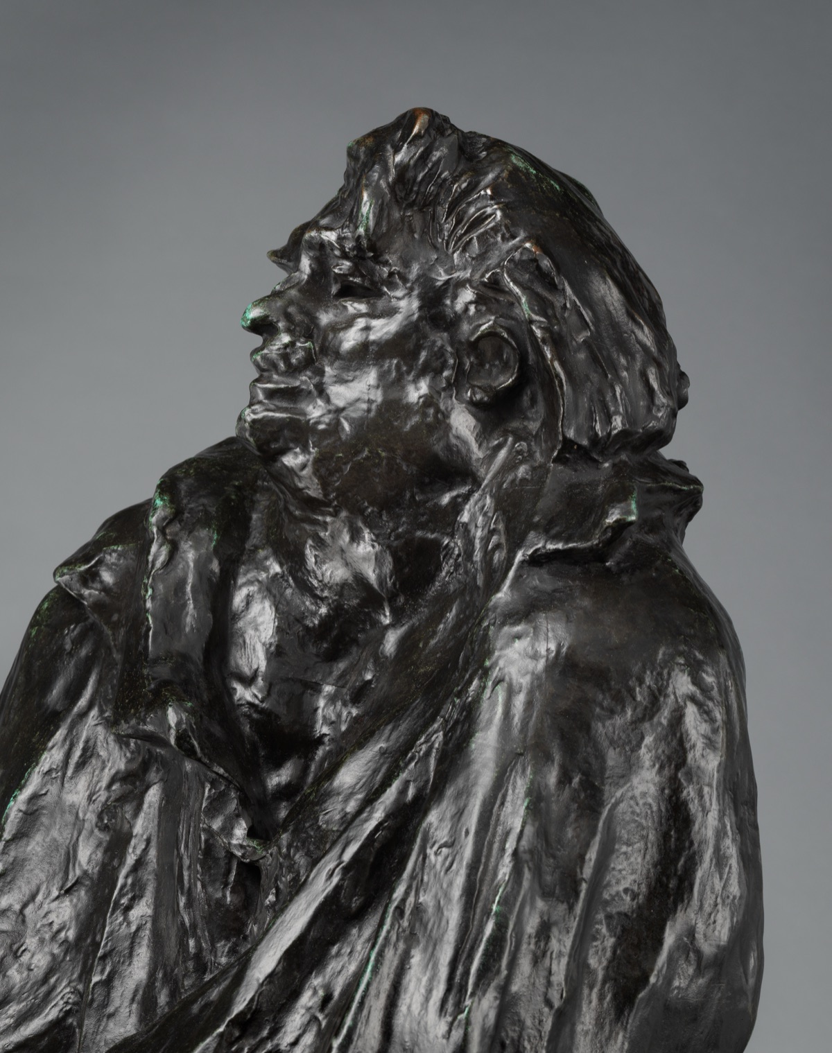 Auguste Rodin, Final Study for the Monument to Balzac. The Metropolitan Museum of Art. Detail of Auguste Rodin's Final Study for the Monument to Balzac: a bronze figure wrapped in a heavy cloak, head thrown back.